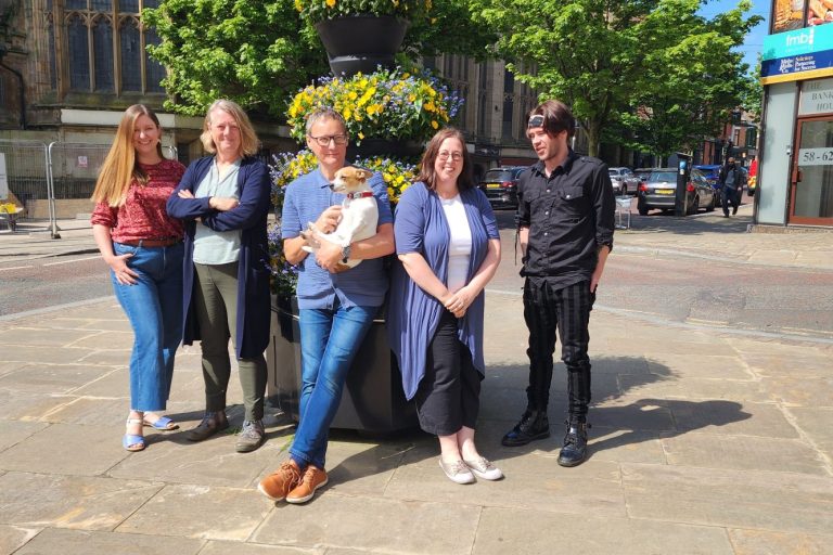 Culturapedia Team Pic A picture of five people and a dog